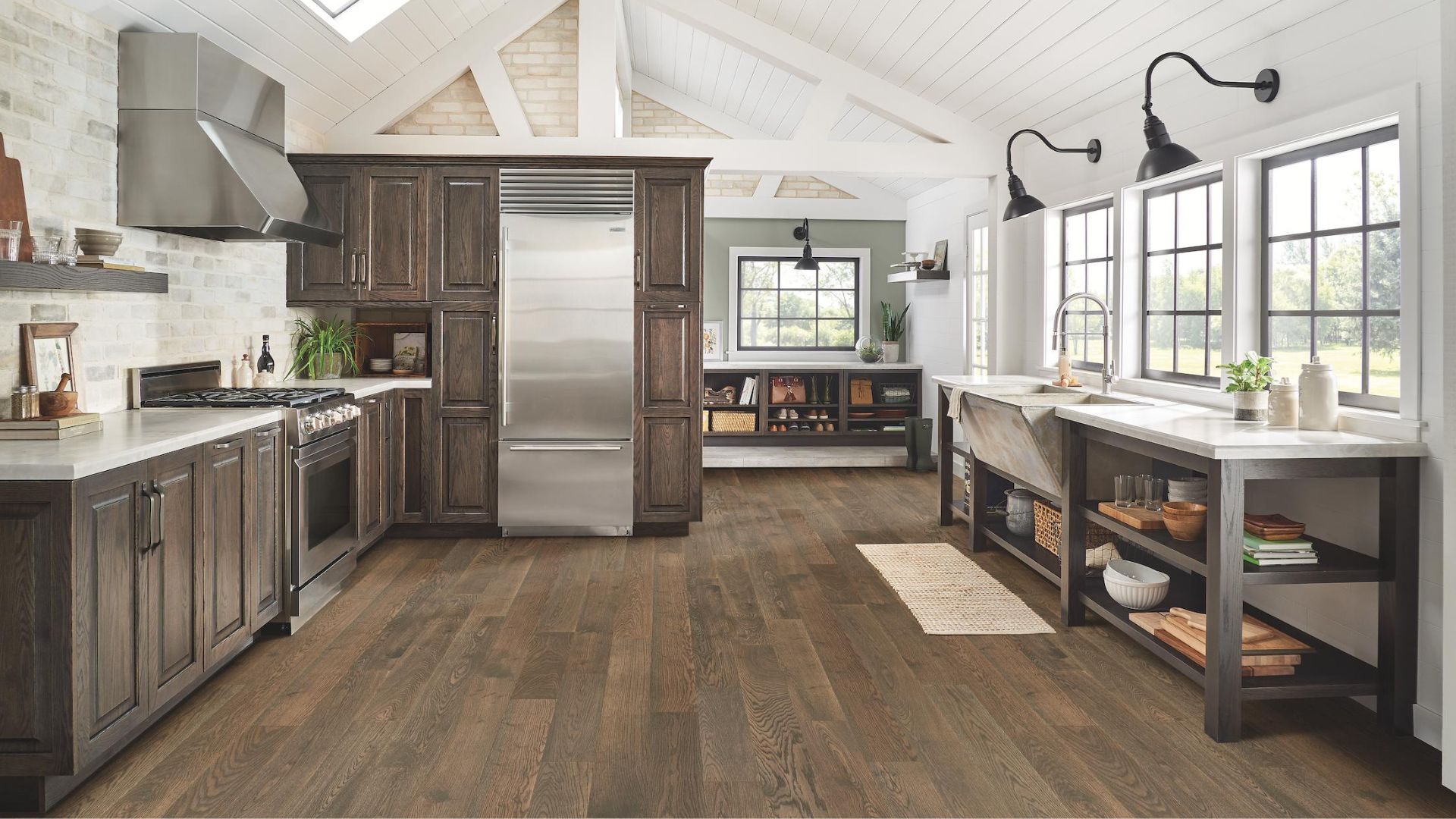 dark stained rustic hardwood flooring in a farmhouse style kitchen